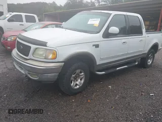 2002 Ford F-150 XLT with VIN 1FTRW08L92KB32427, listed as a IAAI auction lot 41968814 with 325,372 mi miles. Bid and sale history available at carsss.com. Image 2.