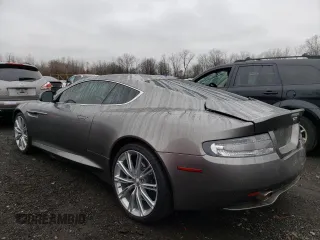 2015 Aston Martin DB9 z VIN SCFFDAEM9FGA16279, wystawiony jako Copart lot #81886554 z przebiegiem 25 029 mil mil oraz Szkody całkowita. Historia ofert i sprzedaży dostępna na DreamBid. Obrazek 2.