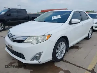 2014 Toyota Camry SE with VIN 4T1BK1FK5EU551196, listed as a IAAI auction lot 41912297 with 104,445 mi miles. Bid and sale history available at carsss.com. Image 2.