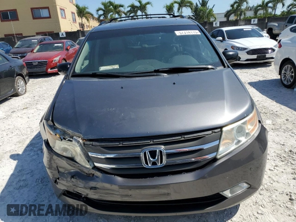 2011 Honda Odyssey Touring with VIN 5FNRL5H97BB501213, listed as a Copart auction lot 57314115 with 283,538 mi miles and Salvage title. Bid and sale history available at DreamBid. Image 5.