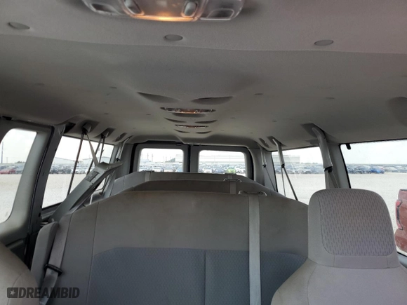 2014 Ford Econoline Wagon XL with VIN 1FBNE3BL0EDA47792, listed as a Copart auction lot 66011154 with 66,753 mi miles and Salvage Title. Bid and sale history available at carsss.com. Image 10.