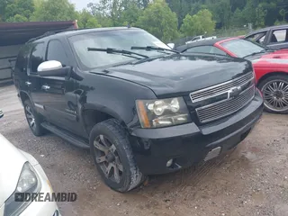 2007 Chevrolet Tahoe LT z VIN 1GNFK130X7R309042, wystawiony jako IAAI lot #42631158 z przebiegiem 158 922 mil mil oraz . Historia ofert i sprzedaży dostępna na DreamBid. Obrazek 1.