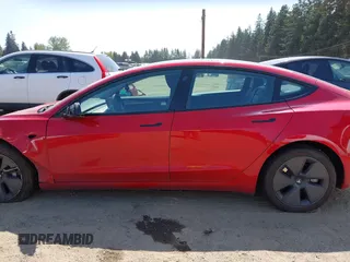 2023 Tesla Model 3 Long Range with VIN 5YJ3E1EBXPF603421, listed as a IAAI auction lot 42105037 with 13,186 mi miles and . Bid and sale history available at DreamBid. Image 14.