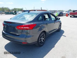 2018 Ford Focus SE z VIN 1FADP3FE6JL223294, wystawiony jako IAAI lot #42067973 z przebiegiem 74 734 mil mil oraz . Historia ofert i sprzedaży dostępna na DreamBid. Obrazek 4.