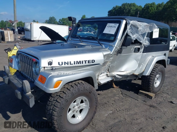 2005 Jeep Wrangler Unlimited with VIN 1J4FA44S55P352803, listed as a IAAI auction lot 42688284 with 128,586 mi miles and . Bid and sale history available at DreamBid. Image 2.
