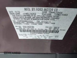 2011 Ford Taurus SEL with VIN 1FAHP2EW8BG137937, listed as a IAAI auction lot 42107586 with 143,525 mi miles. Bid and sale history available at carsss.com. Image 9.