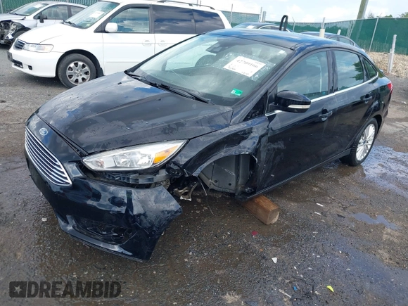 2016 Ford Focus Titanium z VIN 1FADP3J27GL215436, wystawiony jako IAAI lot #42709166 z przebiegiem 75 956 mil mil oraz . Historia ofert i sprzedaży dostępna na DreamBid. Obrazek 2.