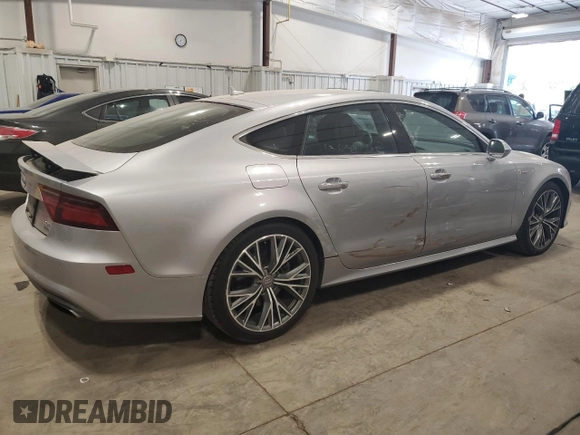 2016 Audi A7 3.0 Prestige with VIN WAU2GAFC7GN104801, listed as a Copart auction lot 64997833 with 74,427 mi miles. Bid and sale history available at carsss.com. Image 3.