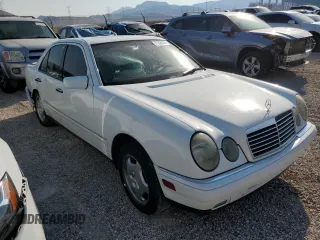 1999 Mercedes-Benz E-Class with VIN WDBJF70H5XA831773, listed as a Copart auction lot 71320244 with 145,181 mi miles and Salvage Title. Bid and sale history available at carsss.com. Image 4.