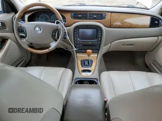 2003 Jaguar S-Type z VIN SAJEA01U33HM71782, wystawiony jako Copart lot #82969304 z przebiegiem 127 176 mil mil oraz Szkody całkowita. Historia ofert i sprzedaży dostępna na DreamBid. Obrazek 8.