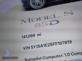 2015 Tesla Model S 85D with VIN 5YJSA1E25FF107819, listed as a IAAI auction lot 41333556 with 141,066 mi miles. Bid and sale history available at carsss.com. Image 15.