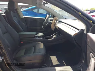 2018 Tesla Model 3 Long Range Battery with VIN 5YJ3E1EA7JF098632, listed as a IAAI auction lot 42002181 with 73,371 mi miles and . Bid and sale history available at DreamBid. Image 5.