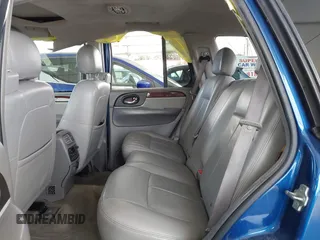 2006 GMC Envoy SLE with VIN 1GKDS13S562252049, listed as a IAAI auction lot 41940052 with 149,445 mi miles. Bid and sale history available at carsss.com. Image 8.