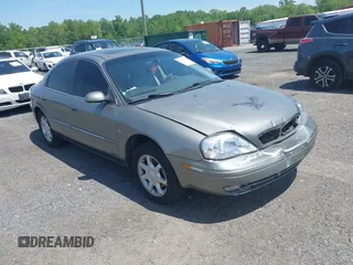 2003 Mercury Sable LS Premium z VIN 1MEHM55S23G627680, wystawiony jako IAAI lot #42234566 z przebiegiem 97 097 mil mil oraz . Historia ofert i sprzedaży dostępna na DreamBid. Obrazek 1.