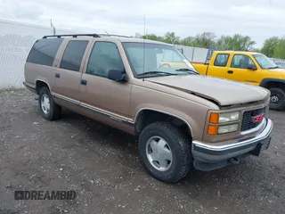 1995 GMC Suburban z VIN 1GKFK16K7SJ748247, wystawiony jako IAAI lot #42174410 z przebiegiem 216 611 mil mil oraz . Historia ofert i sprzedaży dostępna na DreamBid. Obrazek 1.