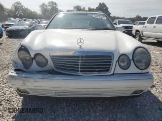 1999 Mercedes-Benz E-Class with VIN WDBJH65F1XA811693, listed as a Copart auction lot 69370604 with 128,876 mi miles and Salvage Title. Bid and sale history available at carsss.com. Image 5.