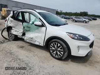 2020 Ford Escape Titanium z VIN 1FMCU9J91LUB53076, wystawiony jako Copart lot #64008765 z przebiegiem Nie podano mil oraz Nie do naprawy • Non repairable. Historia ofert i sprzedaży dostępna na DreamBid. Obrazek 4.