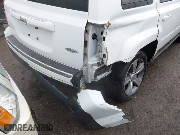2016 Jeep Patriot Latitude with VIN 1C4NJPFAXGD749306, listed as a IAAI auction lot 41474439 with 94,767 mi miles and . Bid and sale history available at DreamBid. Image 6.