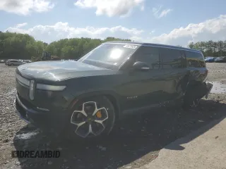2023 Rivian R1S Adventure z VIN 7PDSGABA1PN015015, wystawiony jako Copart lot #55575925 z przebiegiem 26 849 mil mil oraz Szkoda całkowita • Salvage title. Historia ofert i sprzedaży dostępna na DreamBid. Obrazek 1.
