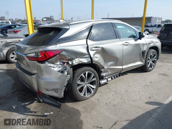 2022 Lexus RX with VIN 2T2HZMAA4NC239034, listed as a IAAI auction lot 41597835 with 33,935 mi miles. Bid and sale history available at carsss.com. Image 4.