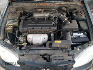 2000 Hyundai Elantra GLS z VIN KMHJF35F6YU890800, wystawiony jako Copart lot #76972294 z przebiegiem 159 134 mil mil oraz Szkoda całkowita • Salvage title. Historia ofert i sprzedaży dostępna na DreamBid. Obrazek 12.
