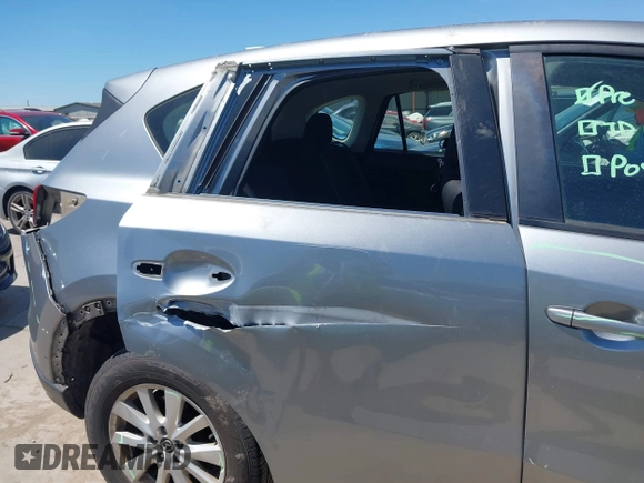 2014 Mazda CX-5 Sport with VIN JM3KE2BE7E0371203, listed as a IAAI auction lot 42243756 with 121,534 mi miles and . Bid and sale history available at DreamBid. Image 6.
