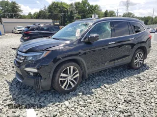 2018 Honda Pilot Touring with VIN 5FNYF6H97JB020899, listed as a Copart auction lot 61339475 with 100,611 mi miles and Salvage title. Bid and sale history available at DreamBid. Image 1.