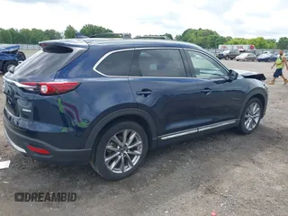 2020 Mazda CX-9 Grand Touring with VIN JM3TCBDY1L0402718, listed as a IAAI auction lot 42355511 with 87,205 mi miles and . Bid and sale history available at DreamBid. Image 4.