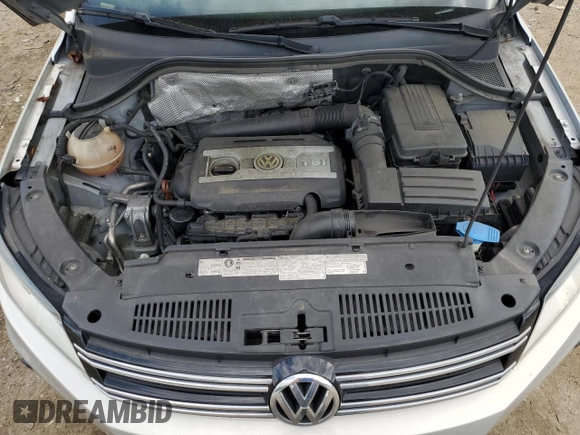 2013 Volkswagen Tiguan SE z VIN WVGBV7AX0DW539618, wystawiony jako Copart lot #71529804 z przebiegiem 148 362 mil mil oraz Szkoda całkowita • Salvage title. Historia ofert i sprzedaży dostępna na DreamBid. Obrazek 13.
