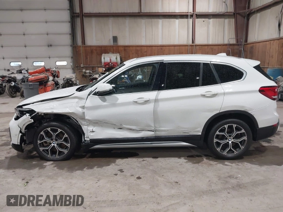 2021 BMW X1 xDrive28i with VIN WBXJG9C04M5T82884, listed as a IAAI auction lot 42242890 with 24,647 mi miles and . Bid and sale history available at DreamBid. Image 14.