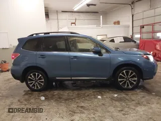 2017 Subaru Forester Touring with VIN JF2SJGTC9HH410251, listed as a IAAI auction lot 41411079 with 131,220 mi miles and . Bid and sale history available at DreamBid. Image 13.