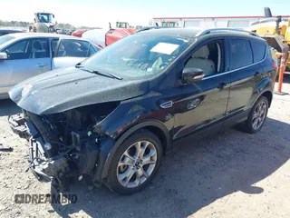 2015 Ford Escape Titanium with VIN 1FMCU0J91FUB36973, listed as a IAAI auction lot 41889560 with 93,445 mi miles and . Bid and sale history available at DreamBid. Image 2.