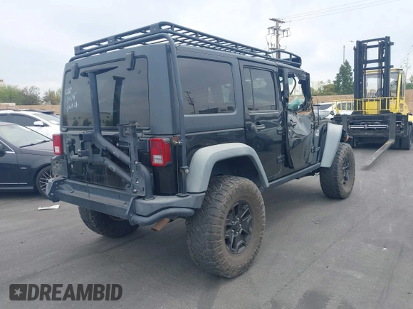 2014 Jeep Wrangler Unlimited Rubicon with VIN 1C4BJWFGXEL172622, listed as a IAAI auction lot 41782796 with 67,594 mi miles. Bid and sale history available at carsss.com. Image 4.
