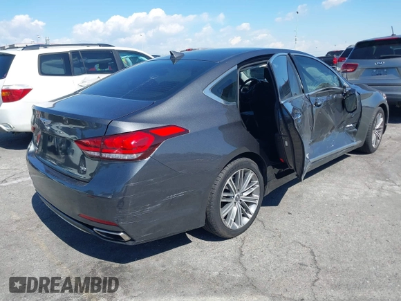 2018 Genesis G80 3.8L z VIN KMHGN4JEXJU283935, wystawiony jako IAAI lot #41750441 z przebiegiem 70 165 mil mil oraz . Historia ofert i sprzedaży dostępna na DreamBid. Obrazek 4.