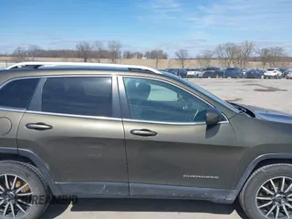 2015 Jeep Cherokee North with VIN 1C4PJMCS9FW588826, listed as a IAAI auction lot 41952883 with 145,586 mi miles. Bid and sale history available at carsss.com. Image 14.