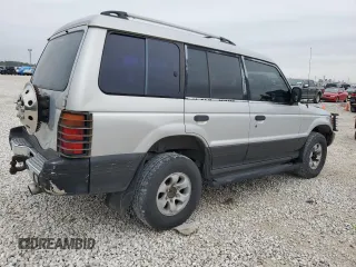 1995 Mitsubishi Montero z VIN JA4MR41H7SJ024208, wystawiony jako Copart lot #42971825 z przebiegiem 313 990 mil mil oraz Szkoda całkowita • Salvage title. Historia ofert i sprzedaży dostępna na DreamBid. Obrazek 3.