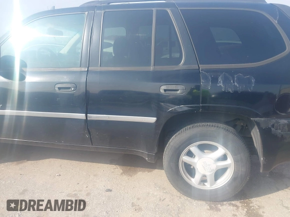 2006 GMC Envoy SLT with VIN 1GKDS13S062234137, listed as a IAAI auction lot 41561864 with 221,031 mi miles. Bid and sale history available at carsss.com. Image 6.