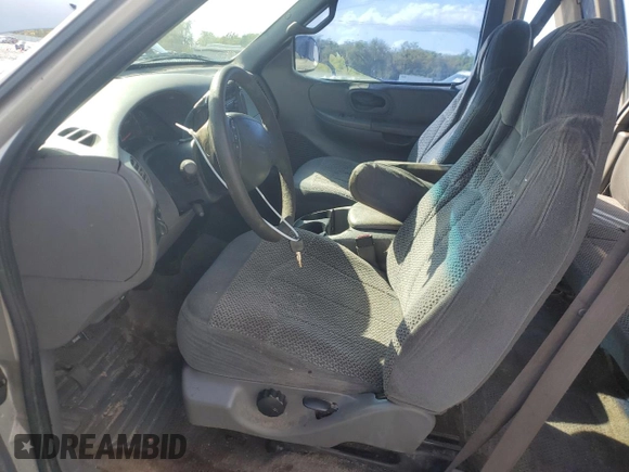 1999 Ford F-150 z VIN 1FTRX07WXXKB92796, wystawiony jako Copart lot #48352405 z przebiegiem Nie podano mil oraz Szkoda całkowita • Salvage title. Historia ofert i sprzedaży dostępna na DreamBid. Obrazek 7.