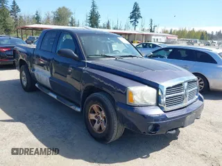 2006 Dodge Dakota SLT with VIN 1D7HW48NX6S708140, listed as a IAAI auction lot 42054527 with 226,944 mi miles. Bid and sale history available at carsss.com. Image 1.