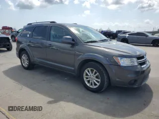 2014 Dodge Journey SXT with VIN 3C4PDCBG8ET140984, listed as a Copart auction lot 54408445 with 135,290 mi miles and Salvage Title. Bid and sale history available at DreamBid. Image 4.