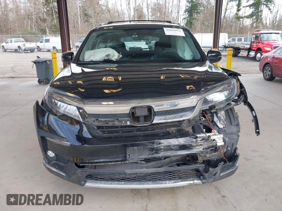 2021 Honda Pilot Elite with VIN 5FNYF6H04MB043014, listed as a IAAI auction lot 41826931 with 63,546 mi miles and . Bid and sale history available at DreamBid. Image 12.