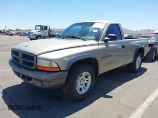 2002 Dodge Dakota with VIN 1B7FL16X72S642881, listed as a IAAI auction lot 42153560 with 220,917 mi miles and . Bid and sale history available at carsss.com. Image 2.