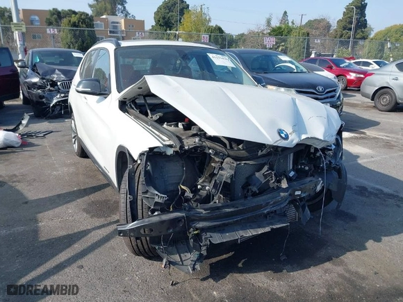 2014 BMW X1 xDrive28i with VIN WBAVL1C52EVY23658, listed as a IAAI auction lot 41153436 with 26,791 mi miles. Bid and sale history available at carsss.com. Image 1.