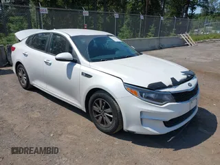 2016 Kia Optima LX z VIN KNAGT4L35G5084121, wystawiony jako IAAI lot #42304418 z przebiegiem 145 202 mil mil oraz . Historia ofert i sprzedaży dostępna na DreamBid. Obrazek 1.