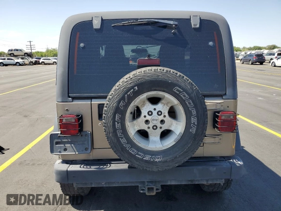 2003 Jeep Wrangler Sport z VIN 1J4FA49S43P327283, wystawiony jako Copart lot #59036295 z przebiegiem 158 108 mil mil oraz Szkoda całkowita • Salvage title. Historia ofert i sprzedaży dostępna na DreamBid. Obrazek 6.