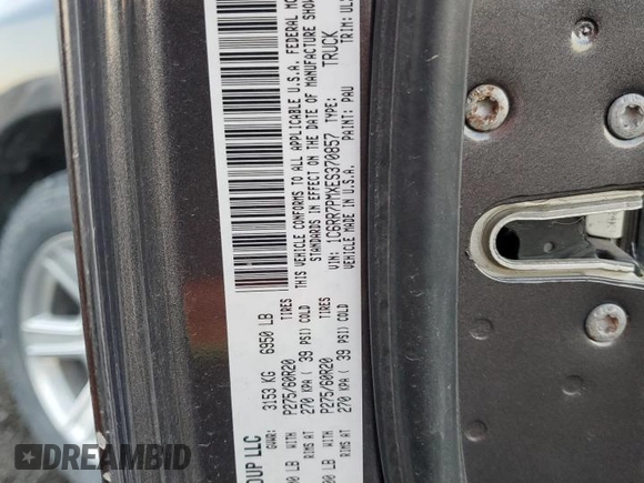 2014 Ram 1500 Longhorn with VIN 1C6RR7PMXES370857, listed as a Copart auction lot 69699954 with 105,590 mi miles and Salvage title. Bid and sale history available at DreamBid. Image 12.