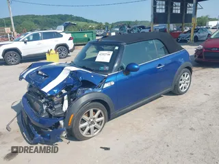 2013 MINI Convertible S with VIN WMWZP3C5XDT705613, listed as a IAAI auction lot 42392748 with 87,477 mi miles and . Bid and sale history available at DreamBid. Image 2.