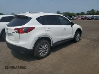 2016 Mazda CX-5 Touring z VIN JM3KE4CY1G0820270, wystawiony jako Copart lot #59664535 z przebiegiem 129 709 mil mil oraz Czysty tytuł • Clean title. Historia ofert i sprzedaży dostępna na DreamBid. Obrazek 3.