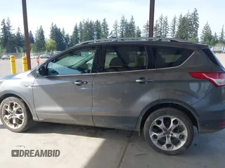 2014 Ford Escape Titanium with VIN 1FMCU9JX0EUC45801, listed as a IAAI auction lot 42121561 with 80,217 mi miles and . Bid and sale history available at DreamBid. Image 14.