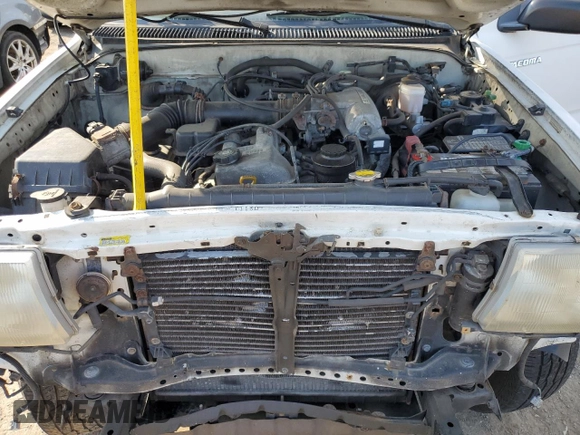 1999 Toyota Tacoma with VIN 4TAPM62N8XZ457624, listed as a Copart auction lot 71565904 with 133,851 mi miles and Salvage Title. Bid and sale history available at DreamBid. Image 11.